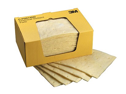 A box of 3M™ Chemical Sorbent Pads, with five pads spread under it.
