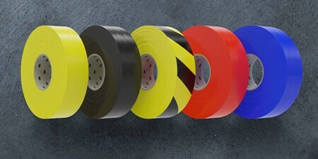 Image of solid yellow, black, red and blue rolls plus one black-and-yellow roll of 3M™ General Purpose Vinyl Tape 764
