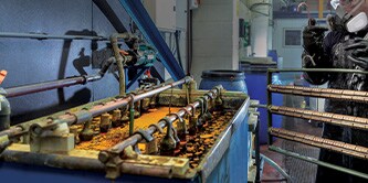 A man is preparing to apply electroplating procedures 
