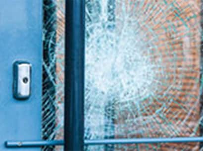3M™ Safety Window Film holds a shattered pane of glass together.
