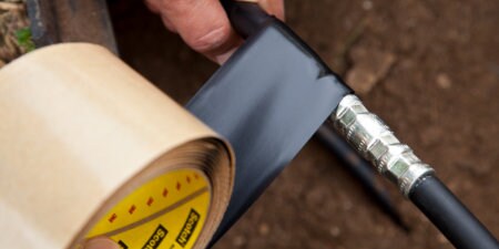 image of 3M vinyl mastic electrical tape being wrapped around electrical connection
