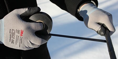 image of 3M vinyl electrical tape being used in freezing conditions
