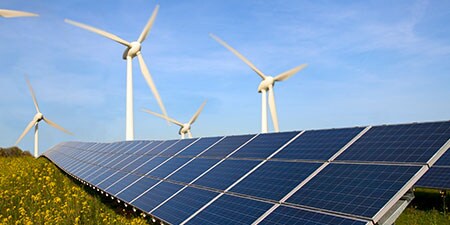 image of solar panels and wind farm
