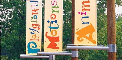 Three wayfinding signs made with 3M graphic films
