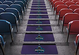 Custom branded 3M printable safety walk applied to stairs in a stadium.