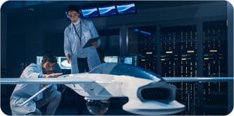 Engineers discuss/evaluate drone design/aircraft design
