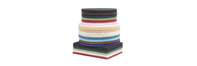 a stack of several different colored 3M floor pads
