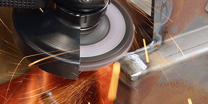 Grinding a weld with a flap disc
