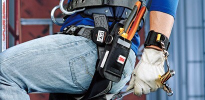 Image of worker wearing a wristband anchor attached to a wrench
