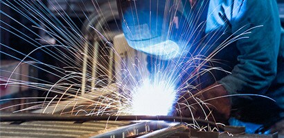 Welder assembling metal structure
