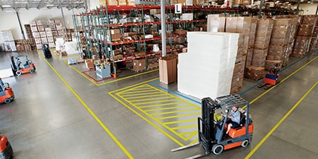 3M Custom printed safety marking applied to floor reminding people to stay 2 meters apart.
