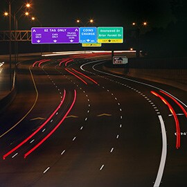 Nighttime highway showing diamond grade reflective tape.