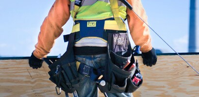 Worker wearing back and tool support belt
