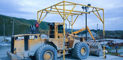 Fall protection access system  around large earthmoving equipment undergoing maintenance
