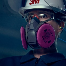 Woman using 3M Reusable Respirator