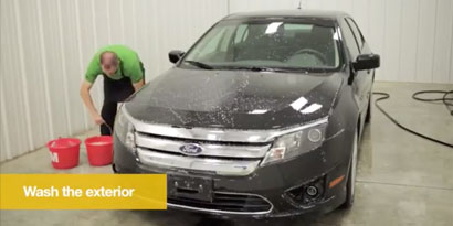 A person washing a car