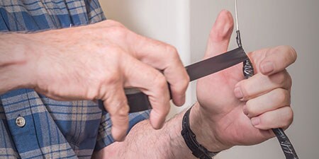 image of 3M General Use Vinyl Electrical Tape being being wrapped on cable
