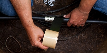 Image of 3M™ Scotch® Rubber Mastic Tape 2228 wrapping a medium voltage cable in a manhole.
