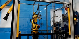 Image of a robot used to mix and apply liquid structural adhesives
